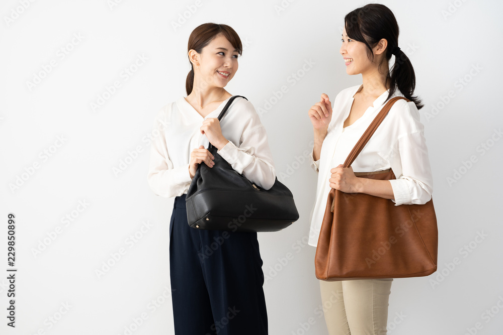 young asian woman walking on white background