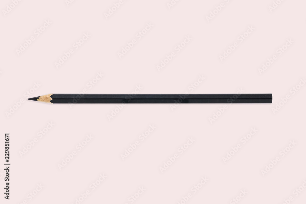 Flat lay black pencil on pink color background. idea minimal concept Flat lay black pencil on pink color background. idea minimal concept