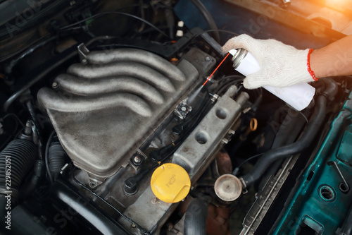 Mechanic hands repair and check old car engine