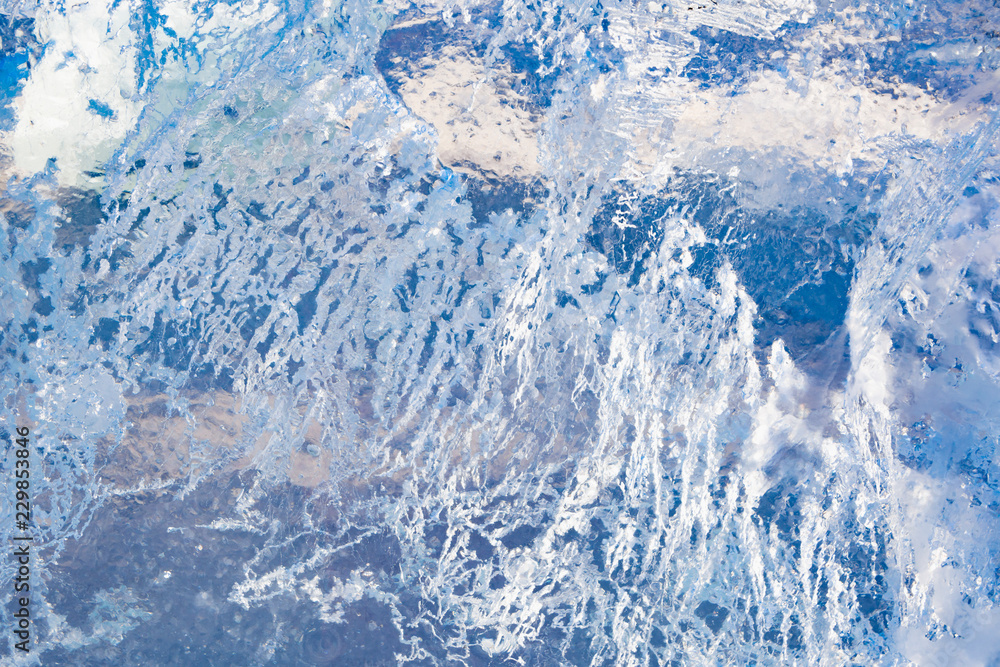 The texture of the ice. The frozen water.Winter background The texture of the ice. The frozen water.Winter background