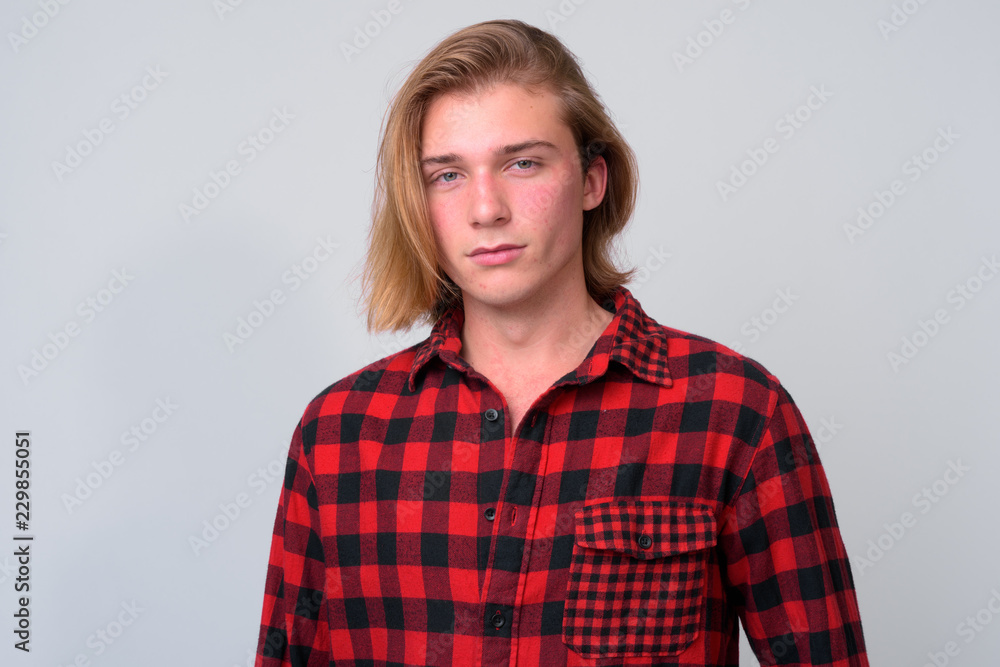 Young handsome hipster man with long blond hair Young handsome hipster man with long blond hair