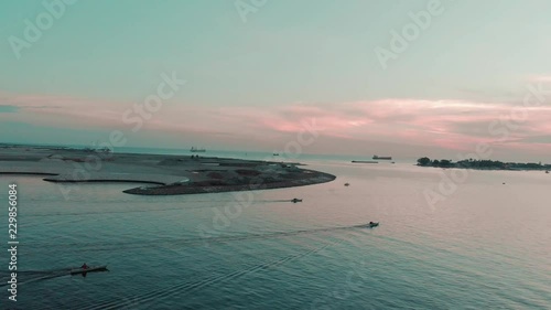 Aerial Pan view of several Traditional Wooden Boats on shore photo