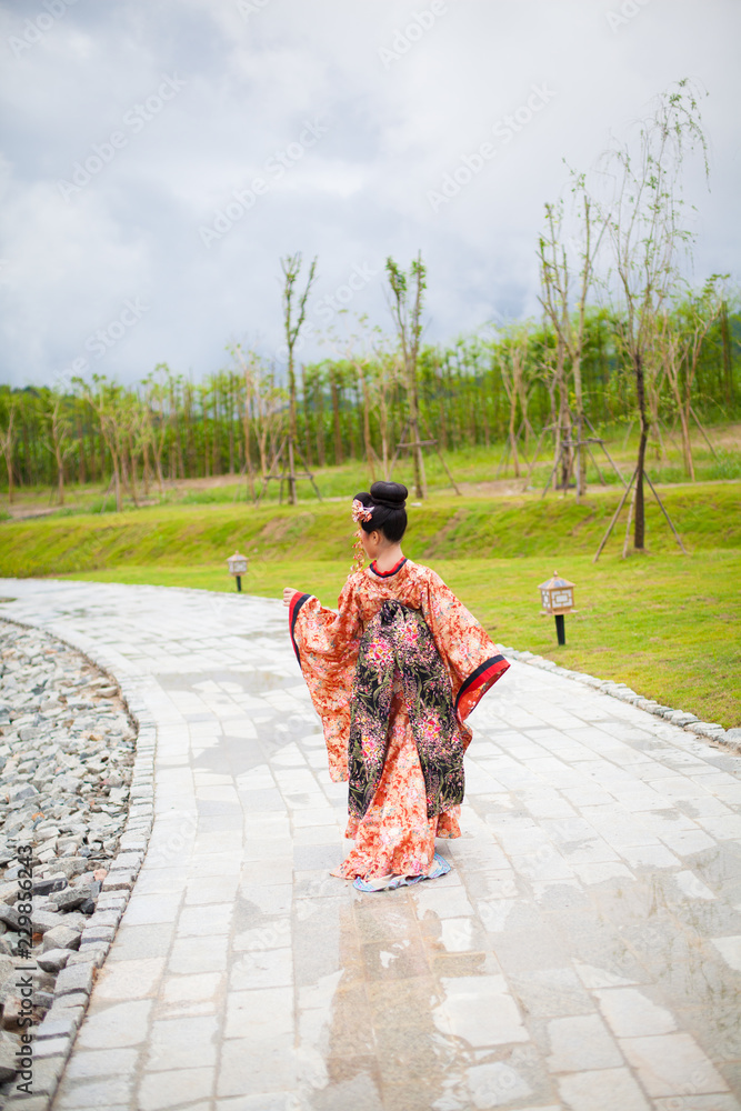 Young women wearing traditional Japanese Kimono at Japanese castle Young women wearing traditional Japanese Kimono at Japanese castle