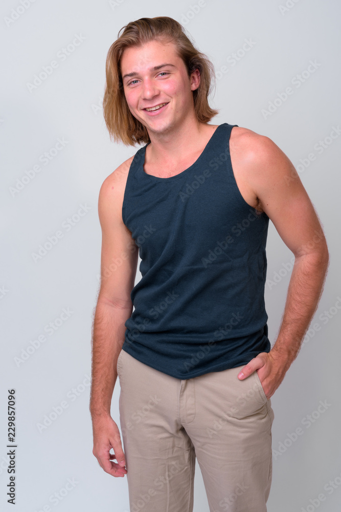 Young handsome man with long blond hair