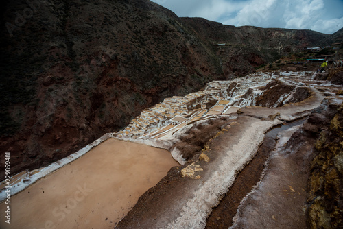 Maras salt evaporation ponds, and the surrounding scenery in sacred valley, Perù. photo