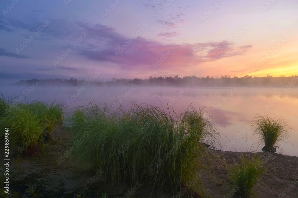 Foggy sunrise on the Tunguska river.  Jewish Autonomous region, far East, Russia. 