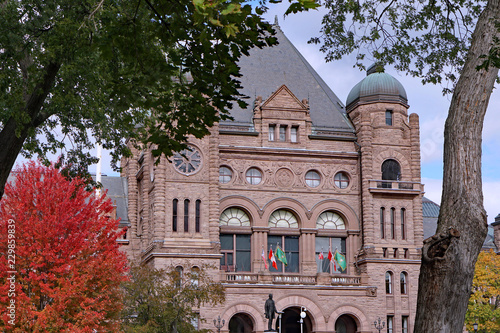 Close up view of the Ontario provincial parliament building surrounded by trees