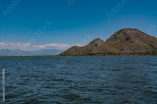 landscape with mountains on the skadar lake in montenegro © Alex