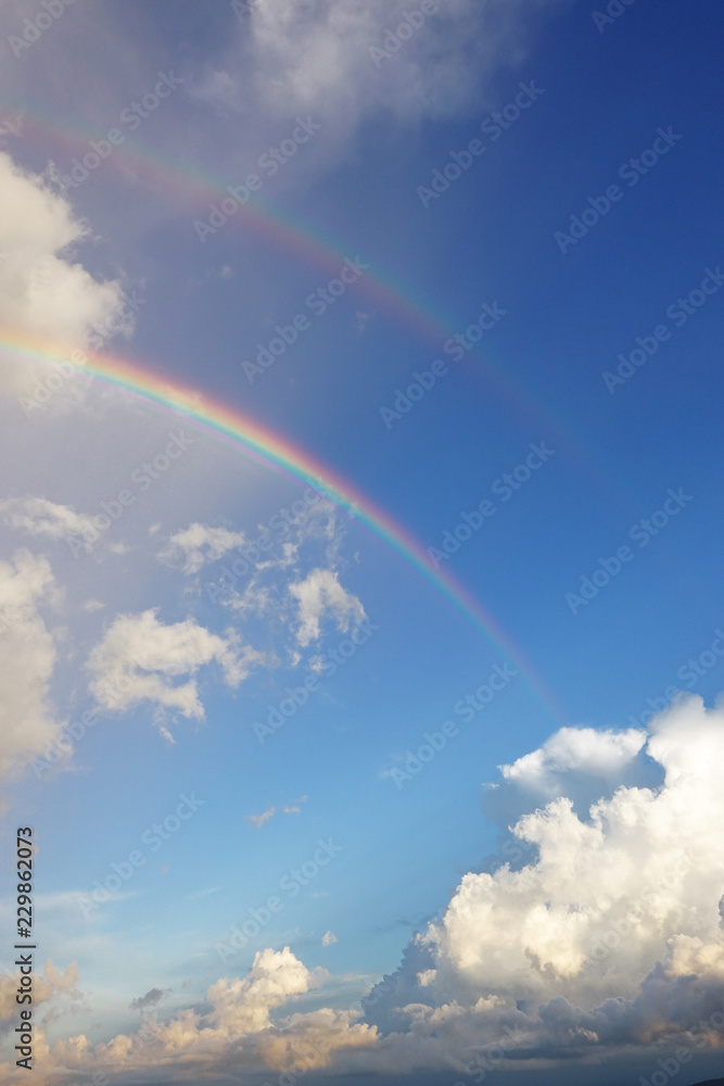 Rainbow in blue sky with cloud for background Rainbow in blue sky with cloud for background