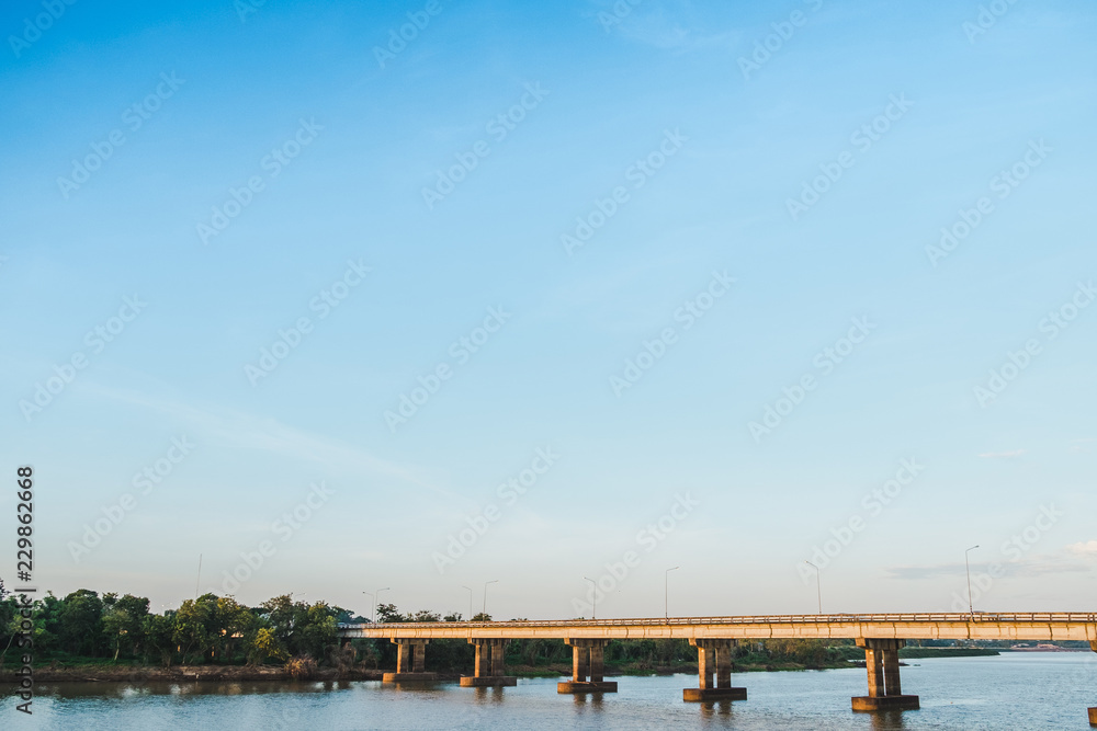 The concrete bridge and river with blue sky