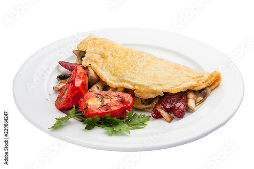 Breakfast. Omelette with sausage and tomatoes. On a white background