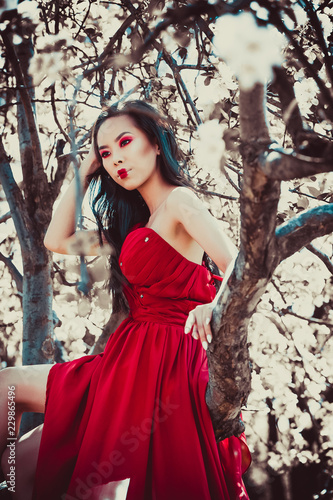 Asian woman in beautiful red dress