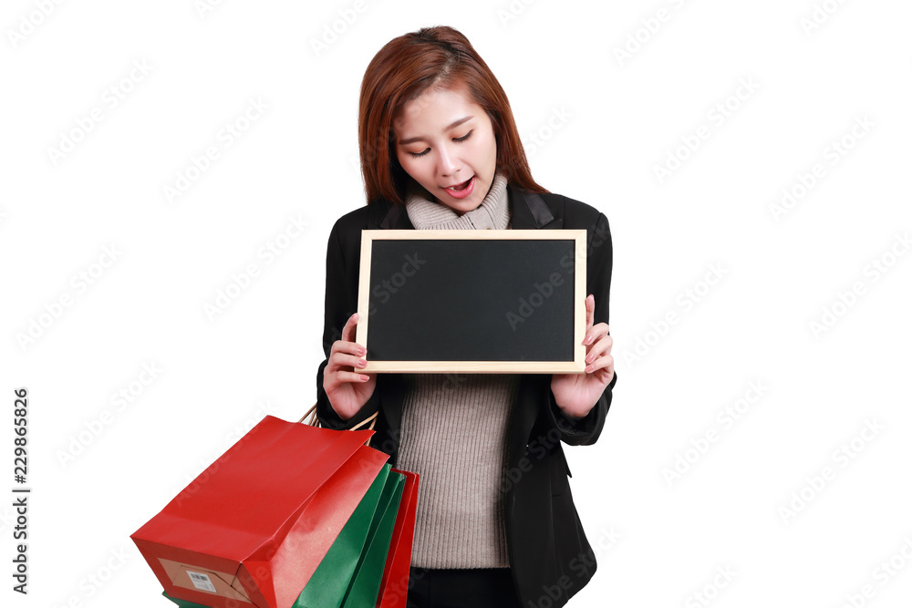 shopping woman holding shopping bags and blank blackboard isolated on white background for you own message shopping woman holding shopping bags and blank blackboard isolated on white background for you own message