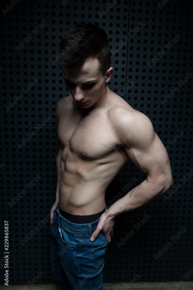 Portrait of Model Man Standing Near the Wall Portrait of Model Man Standing Near the Wall