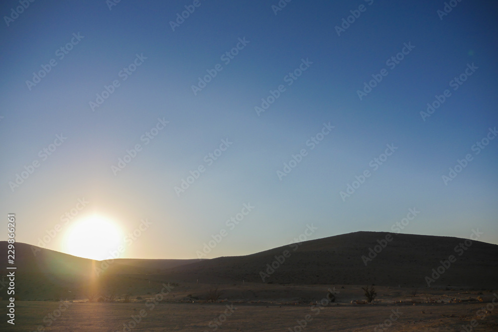 Sunset above mountain in the desert. Israel