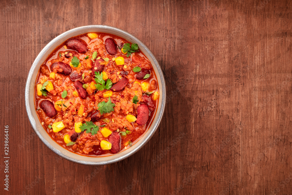 Chili con carne, traditional Mexican dish, overhead photo with a place for text Chili con carne, traditional Mexican dish, overhead photo with a place for text