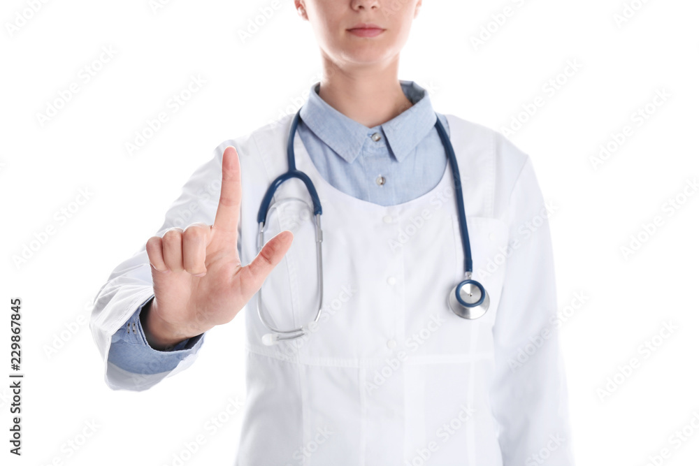 Female doctor pointing on white background, closeup Female doctor pointing on white background, closeup