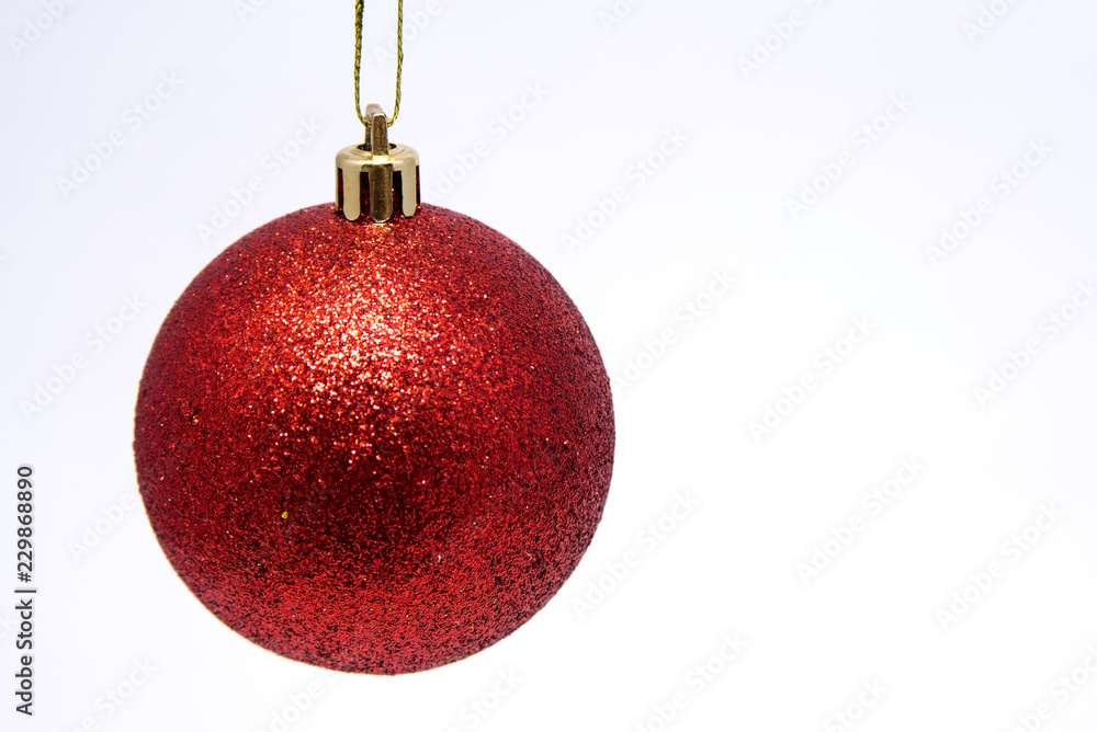 Christmas ball red on white background close-up Christmas ball red on white background close-up