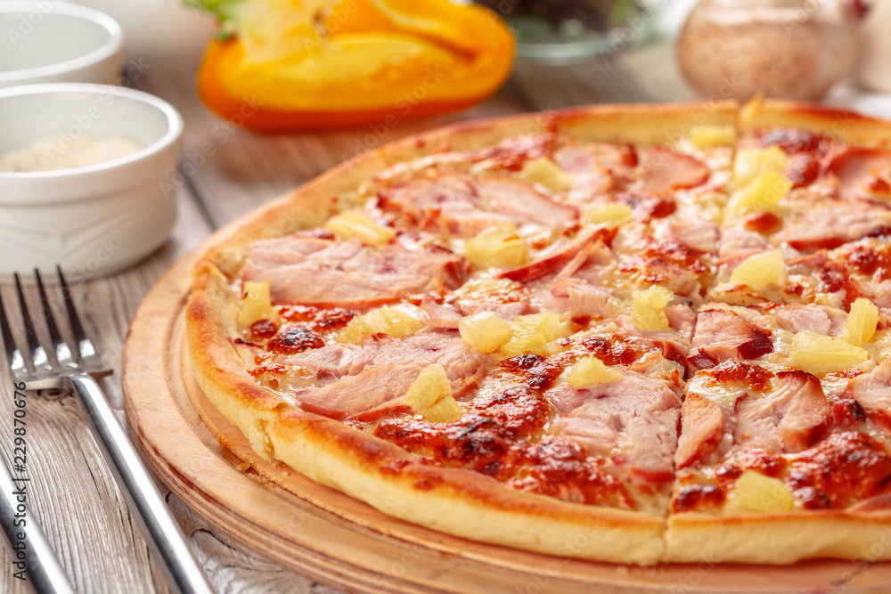 Delicious fresh pizza served on wooden table Delicious fresh pizza served on wooden table