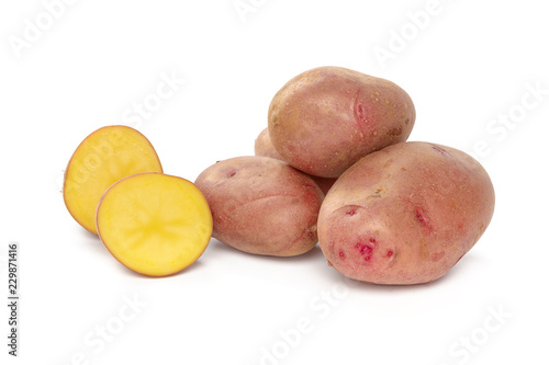 raw potato tuber with slices isolated on white