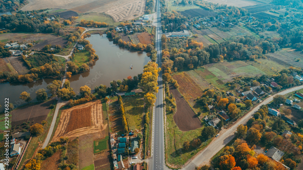Fototapeta premium Aerial view of the new road in Ukraine. Autumn. Road marking.