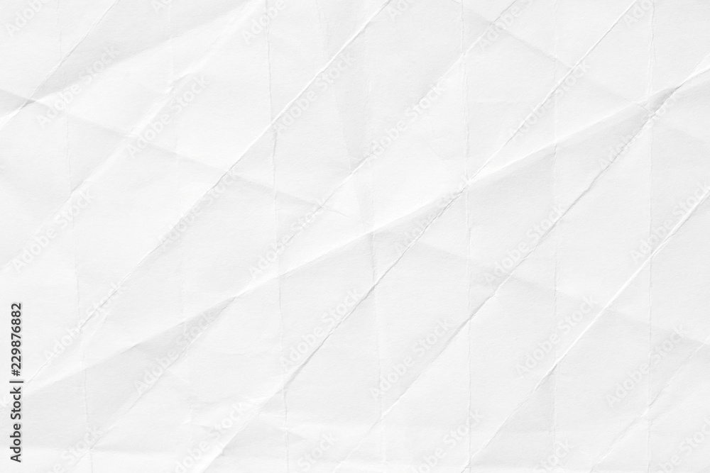 The texture of white paper with kinks. Background of crumpled cardboard. The texture of white paper with kinks. Background of crumpled cardboard.