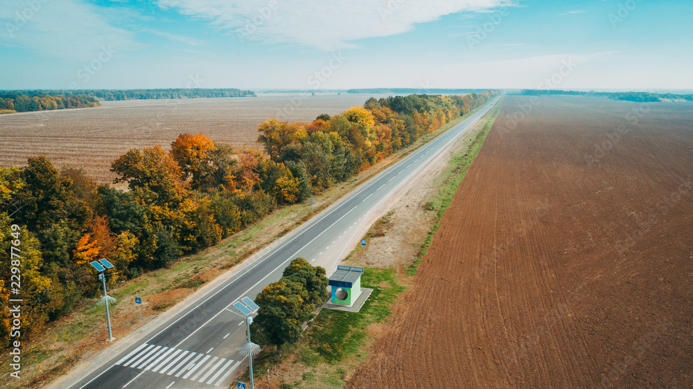 Aerial view of the new road in Ukraine. Autumn. Road marking.