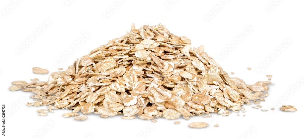 Oat flakes pile on white background
