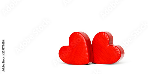 Fototapeta Naklejka Na Ścianę i Meble -  Two red wooden hearts on a white background