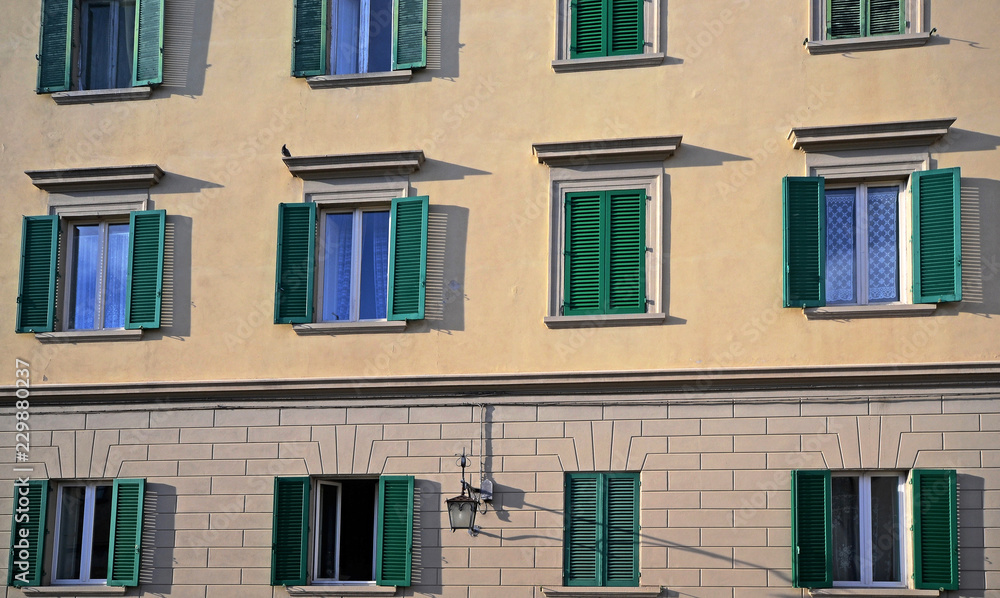 Tuscany, Italy,  wooden windows of the facade of a historic building