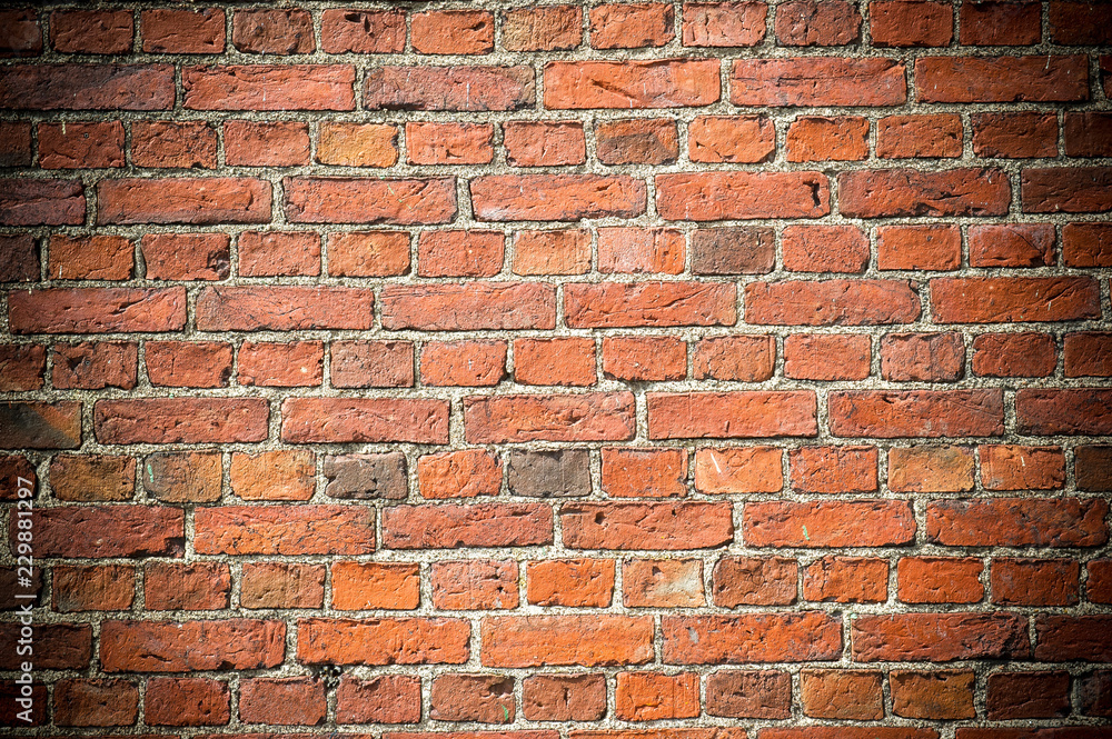 Fototapeta premium red brick wall with vignetted corners