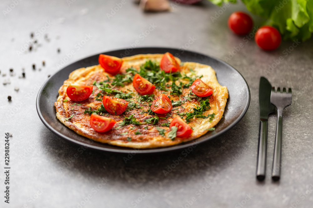 Omelet with tomatoes and herbs. Delicious breakfast Omelet with tomatoes and herbs. Delicious breakfast