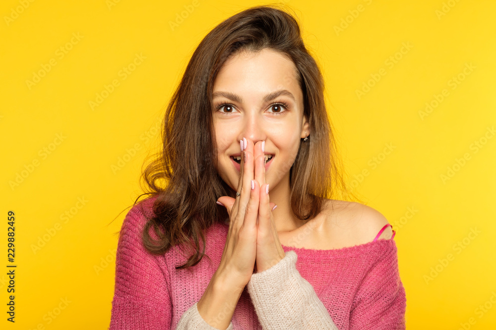emotion face. overwhelmed perplexed shocked surprised astounded woman. young beautiful brown haired girl portrait on yellow background. emotion face. overwhelmed perplexed shocked surprised astounded woman. young beautiful brown haired girl portrait on yellow background.