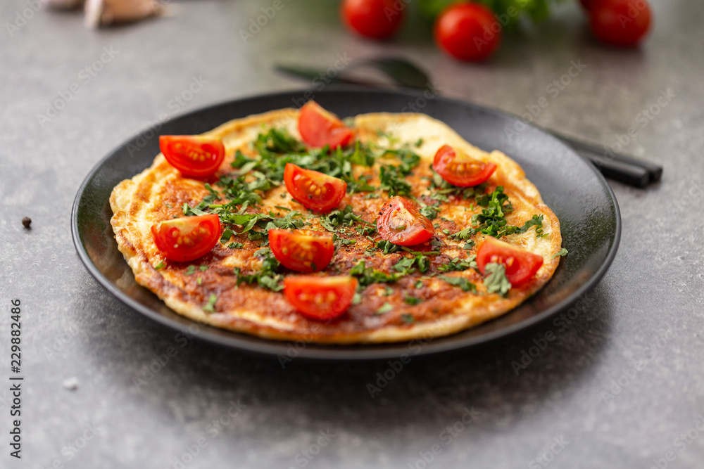Omelet with tomatoes and herbs. Delicious breakfast Omelet with tomatoes and herbs. Delicious breakfast