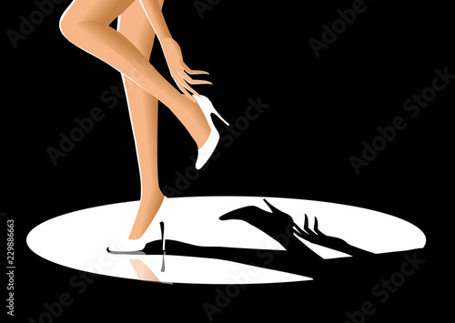 Low section view of a woman adjusting her high heels