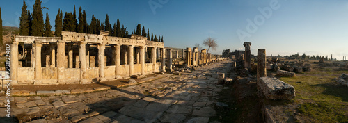 Panorama of the ruins of the ancient city, shot at sunset against the blue sky