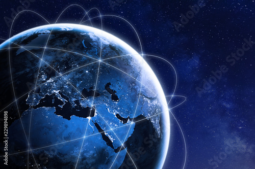 Global connectivity concept with worldwide communication network connection lines around planet Earth viewed from space, satellite orbit, city lights in Europe, some elements from NASA