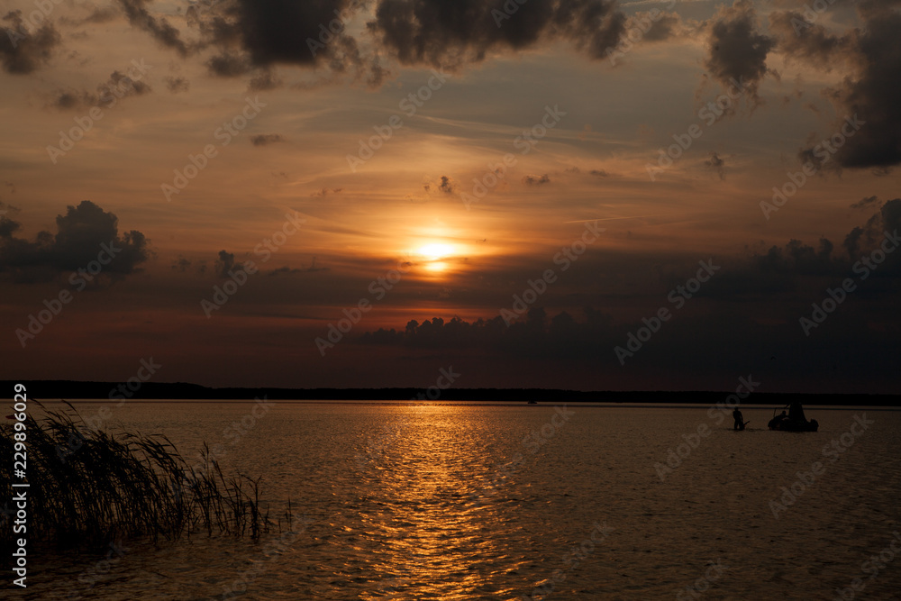 Beautiful summer sunset in the lake Svityaz. Sunset Background