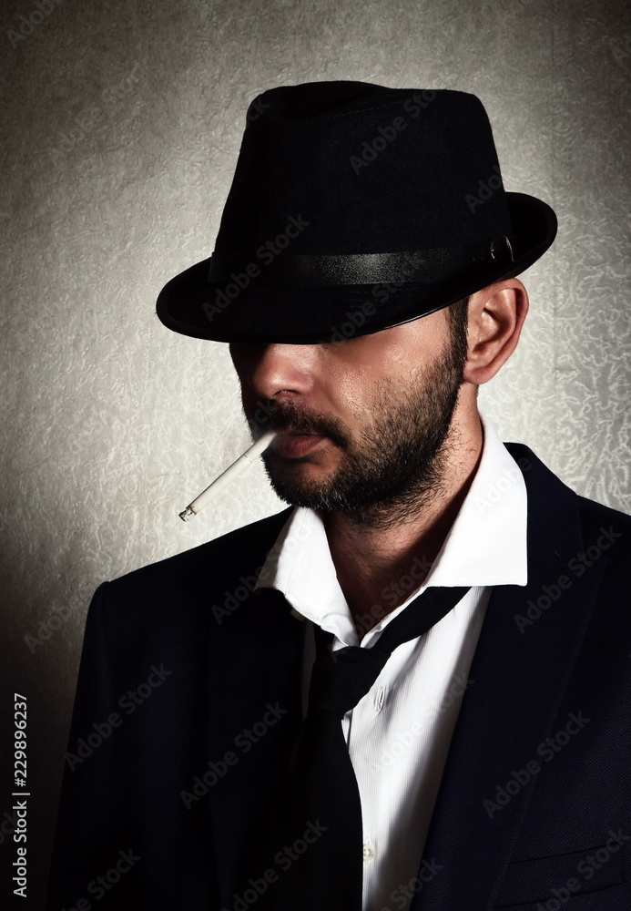 Retro man with the hat and cigarette Retro man with the hat and cigarette