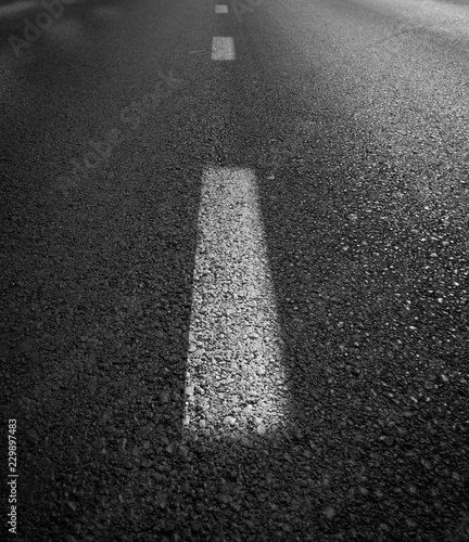 Asphalt road with separation white lines