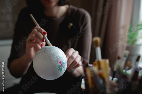 Woman is creating a DIY Christmas tree ball
