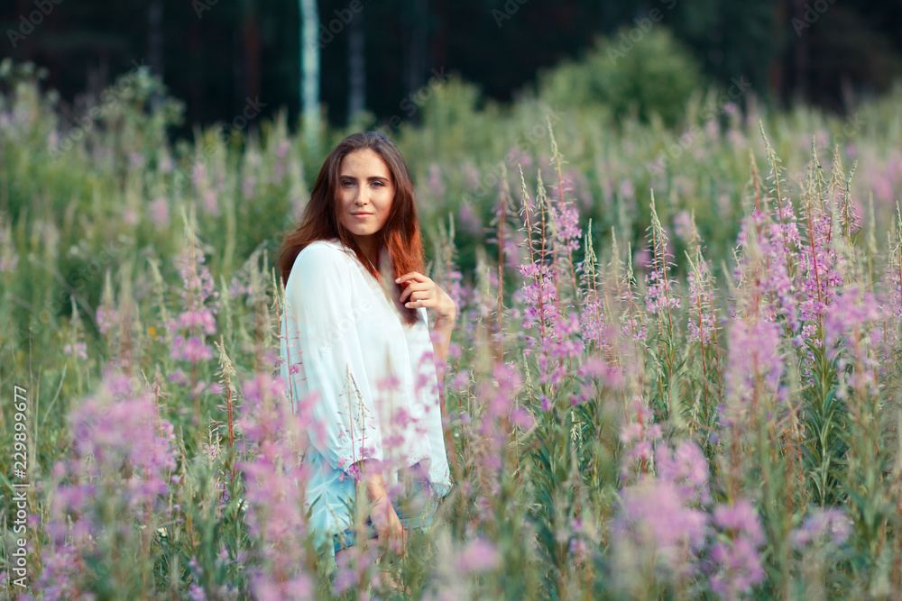 Beautiful girl in a field of flowers Beautiful girl in a field of flowers