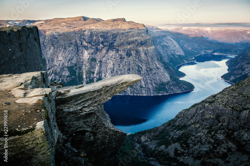Norway tourism attraction - Trolltunga. Troll's Tongue rock in Hordaland county. Ringedalsvatnet lake. photo