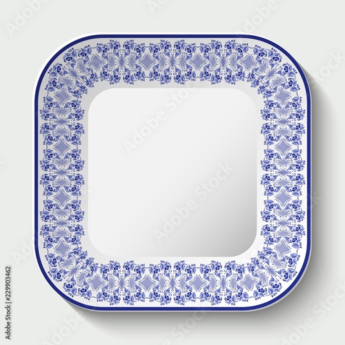 Decorative square plate with ornament in Gzhel style of national painting on porcelain.
