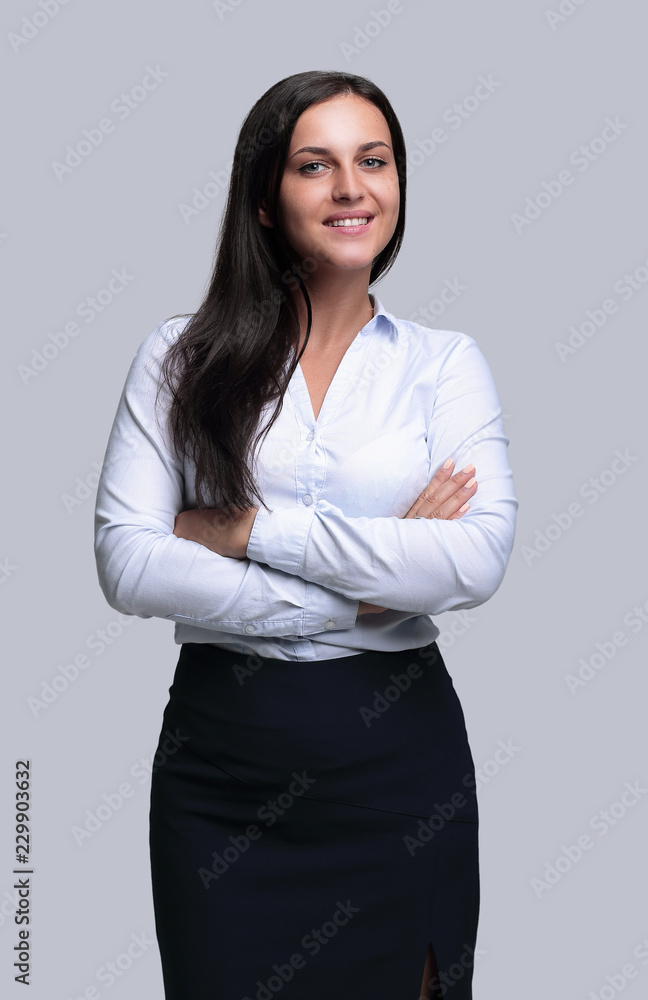 portrait of a smiling young business woman.photo in full growth. portrait of a smiling young business woman.photo in full growth.