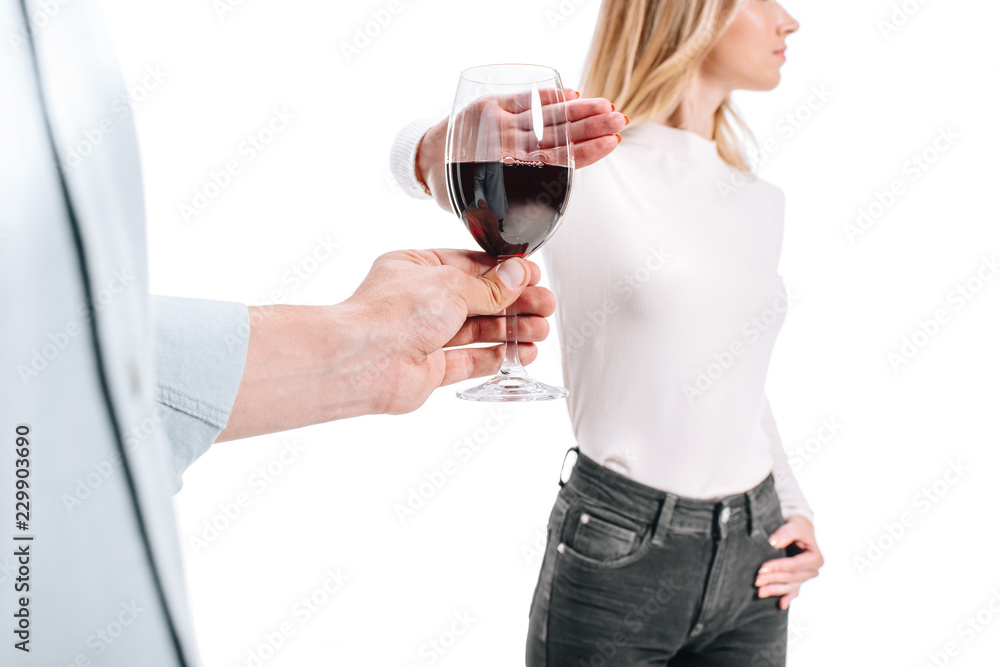 cropped image of woman rejecting glass of red wine isolated on white cropped image of woman rejecting glass of red wine isolated on white