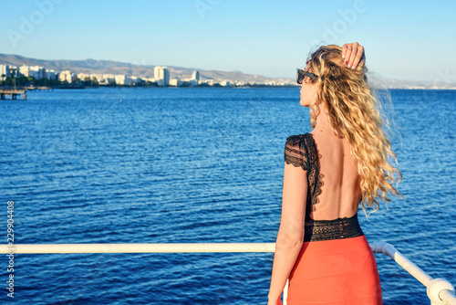 Woman enjoying the summer day portrait Limassol, Cyrpus. Sea view. Vintage st...