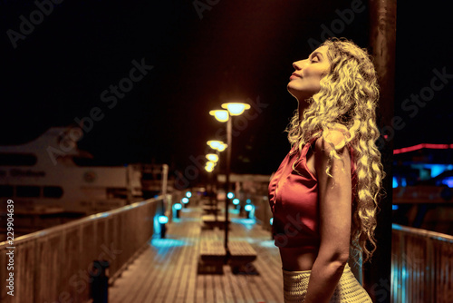 Woman enjoying the summer evening. Port view Protaras, Cyprus