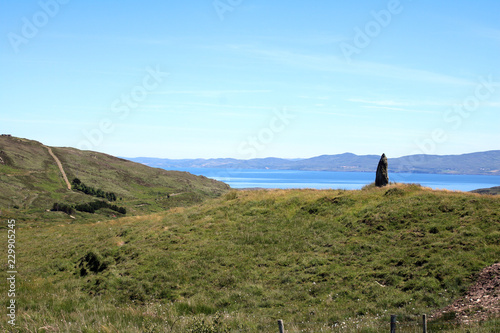 Knocknakilla stone circle situated between Macroom and Millstreet, in County Cork, Ireland. It is set in blanket peatland on the north-west upper slopes of Musherabeg mountain a