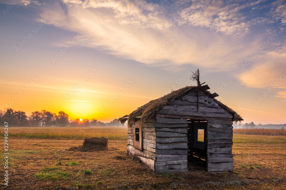 Sunrise over the wooden huts in Lesznowola near Piaseczno, Poland